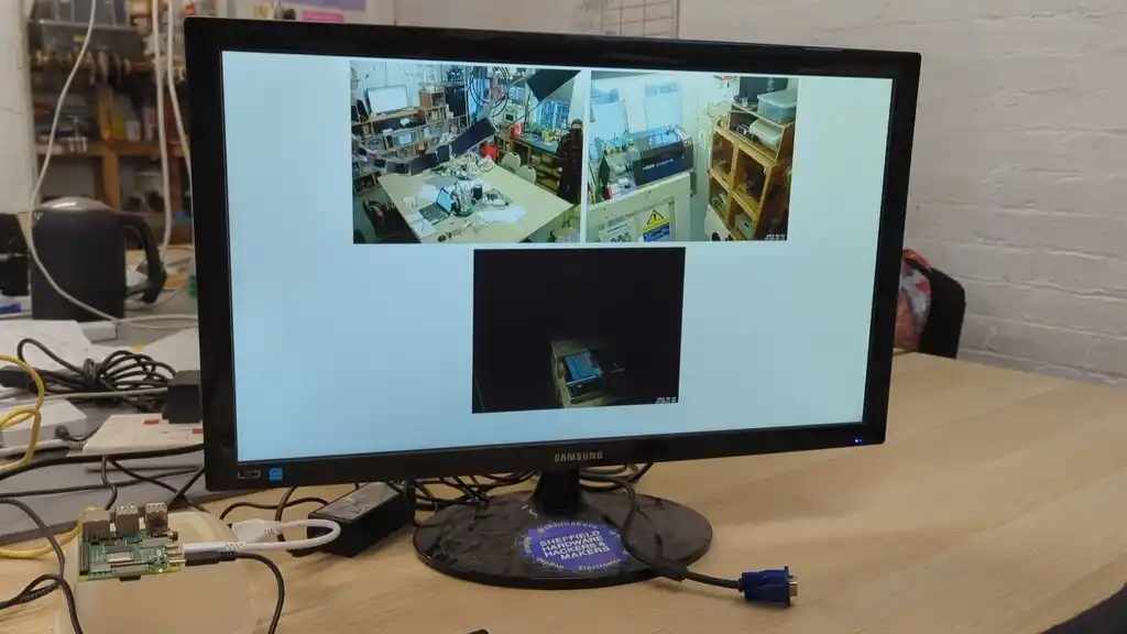 picture of TV screen, showing some camera feeds